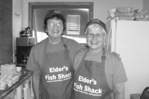 August was busy for Grand Portage Elders and September is shaping up to be full of activities too. Left: There were long lines at the Elder’s Fish Shack at the Rendezvous Days Powwow. Eddie Hertzberg and Johnnie Barton were all smiles during their shift. Above left: To reward the hard-working folks who cooked fish, made strawberry shortcake and sold raffle tickets during Rendezvous Days, a Thank You BBQ was held on Tuesday, Sept. 3. Doris Blank was one of the many seniors who enjoyed the barbecue and visiting. Above right: Bill and Debbie manned the grill for the Sept. 3 barbecue at the Grand Portage Community Center.