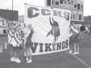 Cook County students are back in school and Viking sports have begun again. This picture from the not-so-distant past is of the 2003 Viking Cheerleaders preparing to welcome the football team onto the field.