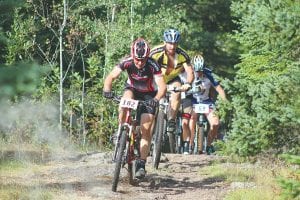 As evidenced by the strain on these mountain bike riders' faces, the first hill in the Sawtooth Mountain Bike Challenge is extremely hard as riders climb from the shore of Lake Superior to the Pincushion Mountain Trail system, a climb of 1,000 feet in 1½ miles. The race was held on Sunday, September 8 with 62 mountain riders taking part on a perfect day to pedal through the woods on the challenging single-track trails that have been built on Pincushion Mountain.