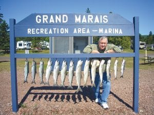 Above: Shel Angle of Coon Rapids, a long-time visitor to the North Shore, with his limit of trout and salmon. Angle was fishing with Captain Jerry Skarupa on Sept. 5 aboard the charter boat Secret Lures.