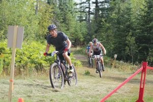 Upper left: Luke Fenwick of Grand Marais led Adam Swank (80) up a hill. Fenwick won the Citizen Race while Swank placed third in the Expert Class. Above: Kailey Todd (72) of Thunder Bay won the Expert Class, a ride of 21 miles. Far left: Gerald Hamm (182) of Thunder Bay was the male winner of the Sport Class. Middle left: Suzy Smith (183) was the first woman across the line in the Sport Class. Left: Josh Gillingham (74) of Thunder Bay was declared the winner in the Expert Class after several riders ahead of him took a wrong turn.