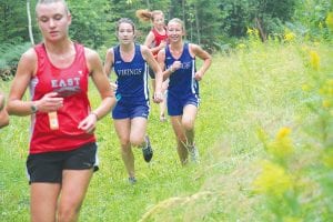 Above: Audrey Summers and a smiling Maya McHugh are the top two girls on the cross country team this year. Both put in a good summer of running and both have made great strides in their development as distance runners.