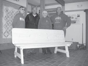 This bench was created by Karl Crawford and will be raffled off at the celebration of the 10th anniversary of the Cross River Heritage Center, which is run by the Schroeder Area Historical Society. The bench was inspired by the late Bob Silver, an accomplished woodworker, West End historian, and Schroeder resident. The celebration will take place at the Cross River Heritage Center from 1:00 to 4:00 p.m. Saturday, September 21, and the raffle will be at 4:00. (L-R) Deonn Cicak, Karl Crawford, Barb Livdahl and Steve Schug.