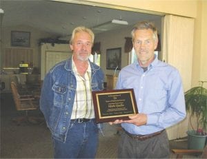 Mark Quello of Grand Marais (right) was honored recently for his 20 years of dedicated service with Arrowhead Transit. Mark has been a driver with Transit since February 8, 1993. Presenting Mark with a plaque is the Associate Director of Arrowhead Transit Joe Gentile.