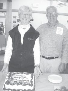 Right: Two cakes were finished off during the 10th anniversary celebration of the dedication of Cross River Heritage Center in Schroeder on September 21. Here Judy Gregg and Skip Lamb wait for the cake cutting to begin. Above: Mike Montie was the very enthusiastic winner of this Bob Silver-inspired bench created by Karl Crawford of Schroeder and was raffled off at the celebration. Montie’s answering machine message says, “Hello, this is Mike. Only leave a message if I won something.” His birthday was one week later.