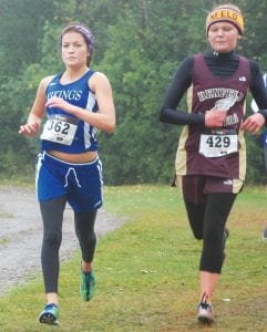 Left: Matea Acero, a sophomore, is running strong again after recovering from injuries. Matea placed 25th in the sophomore race at the Swain Invitational in Duluth. Above: Showing nice running form and muddy legs, Lynden Blomberg ran the 3k race on the hilly Swain course in 15:17. Good job Lynden!