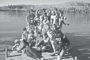 Area bikers are getting in as much riding as they can before winter hits. A group of over 60 riders gathered recently for a ride and potluck dinner, some of them posing at Caribou Lake.