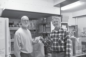 David Johnson (right) of the Sons of the American Legion, Post 413, presented a check for $700 to David Prinsen of the Cook County Food Shelf recently. The Sons group recognizes that there is an increased need at the Food Shelf in the fall and winter and wanted to do their part. If you would like to contribute non-perishable food items, make a financial contribution, or volunteer some time, call (218) 387-2113 for more information. Checks may be mailed to: Cook County Food Shelf, PO Box 95, Grand Marais, MN 55604.