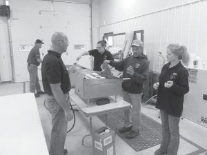 The traditional Lutsen Fire Department Pancake Breakfast was held for the first time this September in the new community room. Above: Firefighters had room for the big pancake griddle in the fire hall. Firefighters went through 15 batches of the Lutsen secret recipe pancakes, serving 265 people. Left: Tourists and residents, like this fall season visitor and Patty Nelson of Lutsen, enjoyed visiting over breakfast.