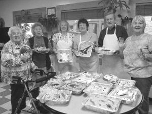 October was a busy month for the Grand Portage Elders, preparing for the Grand Portage Halloween Carnival. Above: Elders who decorated the delicious cakes for the carnival cakewalk were (L-R) Bernice LeGarde, Ellen Olson, Carol Conrad, Eddie Hertzberg, Bob Hertzberg, Carol Hackett. (Not pictured: Patty Winchell- Dahl). Left: Marie Spry received a gift and a heartfelt Thank You for her nine years as chairwoman of the Grand Portage Elder Advisory Committee.