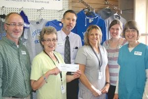 The staff from Arrowhead Pharmacy is shown holding the $1,200 check that was going to be turned over the Cook County High School Booster Club for sales of Viking merchandise sold through the store this summer. (L-R) Chris Goettl, Jane Barid (holding check), George Badeaux, Chris Goettl, Jill Kort and Janet Rindquist.