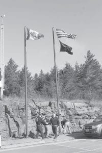 Mission accomplished! High winds made posting the flags outside Grand Portage American Legion Post 2009 difficult. Once the flags were proudly flying, legion members gathered inside for a ceremony that including a meaningful speech by Melvin Gagnon and honor songs by the Stonebridge Singers drum.