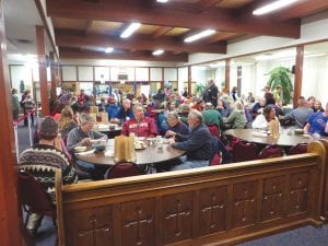 Above: Just a few of the more than 500 people who turned out to participate in the Empty Bowls fundraiser held this year at St. John's Catholic Church on Thursday, November 14. More than 20 businesses donated soup and items to be auctioned to help raise money for the Cook County Food Shelf.