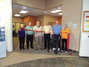 The Grand Portage branch of the North Shore Federal Credit Union opened in the Grand Portage Trading Post on October 7. The credit union board of directors took a tour of the new facility on Thursday, November 21 and made the opening official with a ribbon cutting. (L-R) Serine Ege, Ken Tuorila, Jim Lukken, Credit Union President Mark Summers, Rollie Bourdage, and Judy Motschenbacher. The new location is a full-service branch offering all the services of the other branch locations. It is open four days per week from noon until 5 p.m.