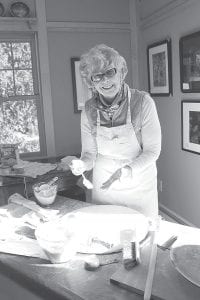 Above: Visitors to the Heritage Center enjoyed Krumkaka and lefse. Linda Lamb demonstrated the lefse making process.