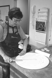 Using old world techniques and secret methods and a recipe reputedly handed down from the Norse Gods, about a dozen women (and a couple of men) made lefse at the Bethlehem Lutheran Church in Grand Marais recently. Martha Rosbacka displays one technique used to make perfect lefse. Any that weren’t deemed perfect were cast aside and eaten as mistakes, and the mistakes tasted excellent. The lefse will be sold at the Julefest celebration held at 1 p.m. Saturday, December 14 at Bethlehem Lutheran Church and the money raised will go towards funding youth group activities.