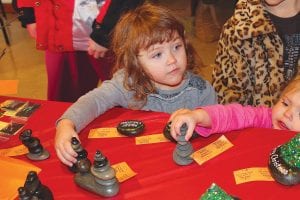 The holiday season is approaching and shopping opportunities abound throughout the county. All ages enjoyed shopping at the North Country Creations Bazaar at the Schroeder Town Hall on Saturday, November 23. These little girls were delighted with the Christmas rock creations on display by Sandi Wirt. See more of Schroeder’s holiday events on page B2.