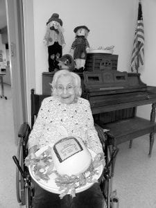 Irma Toftey was the proud winner of a 12-pound turkey at the Turkey Bingo game at North Shore Care Center before Thanksgiving. Her family was happy to receive it!