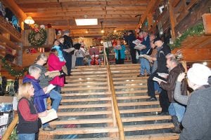 The Lake Superior Trading Post was the scene of a“flash mob”Cook County style on Saturday, November 30. Members of the Borealis Chorale began filtering into the store shortly before 11 a.m. Once in place, singers and musicians offered an exquisite rendition of the Hallelujah Chorus from Handel’s Messiah. After the impromptu performance and applause from the delighted audience, the participants quietly went their separate ways.