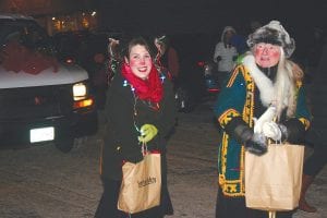 Above: The Chamber Christmas Parade is small but colorful with an appearance by the very- Scandinavian Sivertson Gallery crew who won the “most festive” award. Right: The “Best Overall” Traveling Gnome trophy once again went to Joynes Ben Franklin with its gingerbread theme.