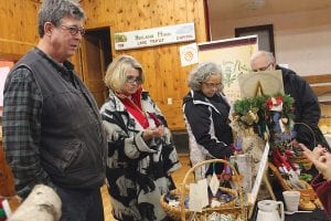 Christmas shopping was fun at the Hovland Town Hall on Saturday, Nov. 30. These shoppers check out felted gnomes made by Mary Jo Flack in the “Land of Hov.”