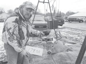 Above: Brian Schroeder of Grand Marais took 4th place in the “Bucks under 180 Pounds” category with a nice 179.58-pound buck. Schroeder won a Thompson center impact .50 muzzleloader. Left: Also winning in the “Bucks under 200 Pounds” category was Cory Pederson of Grand Marais. He came in 10th with his 197.71-pound buck. Pederson takes home a Big Max 4’x8’ utility trailer.