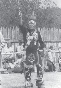 Above: Unbeknownst to most of his family, the late Lex Porter— pictured here in powwow regalia—was a member of the legendary Military Code Talkers in World War II. Left: Joe Porter of Grand Portage visits with Congressman Rick Nolan after the ceremony recognizing his father Lex Porter.