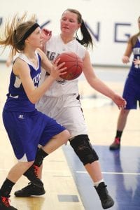 With her eyes on the hoop, Suzy Burton launched a shot in the game against Two Harbors. For the night Burton scored 5 points.