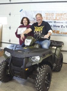 As reported earlier this month, Dallas Smith of White Bear Lake and Grand Marais, was the winner in the Mills Fleet Farm Big Buck Challenge, a statewide contest. Smith won first place in the “Biggest Doe” category with a doe weighing in at 160.16 pounds. Smith is pictured here, claiming his prize, a Polaris Sportsman 500. With him is his girlfriend—and hunting partner—Tammi Cox. Tammi reported that they were hunting north of Grand Marais on opening day of hunting. Tammi said the big doe was taken with the first shot from about 320 yardS with Dallas’s 300 Winchester.