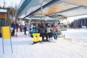 With the recent 30-inch snowfall and the opening of a new high-speed lift, the ski season is off to a record start at Lutsen Mountains. A ribbon cutting was held on Friday, Dec. 13 before the new lift began transporting happy skiers up Moose Mountain. The new lift cuts the time it takes to get skiers back to the mountaintop by one-third, from around 10 minutes to 3½ minutes. The new lift will give skiers and boarders access to 90 percent of the runs on Moose Mountain.