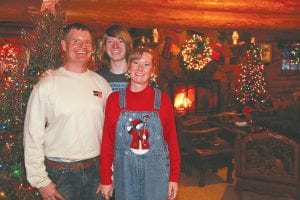 David and Shawn Howe pose here with their son Christopher in the main lodge of Solbakken Resort on Superior, which they purchased along with partner Dale Jackson last June. They gave up dairy farming to enter the hospitality industry after falling in love with the North Shore a year ago.