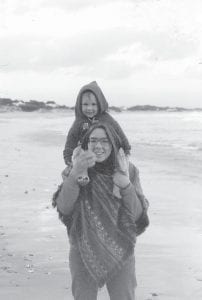 This week’s Spiritual Reflections columnist, Mary Ellen Ashcroft, had the interesting experience of living in the shadow of Robben Island, where Nelson Mandela was imprisoned. She is pictured here with her son, Andrew, at the beach in Hermanus, South Africa in March 1979.