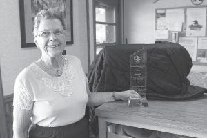 Rosemary Lamson of Grand Marais with the lovely crystal award she received for being named to the International Nurses Association.