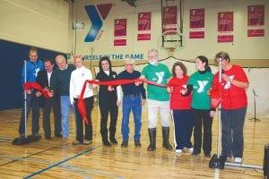 It was a weekend of celebrating for the Cook County Community YMCA as the new facility opened its doors. A ribbon cutting ceremony was part of the event. Taking the ceremonial cut in the newly refurbished gymnasium were (L-R) YMCA Resource Director Mark Hennessy, Duluth Area Family YMCA CEO/President Chris Francis, Cook County Commissioners Bruce Martinson and Heidi Doo-Kirk, Duluth YMCA Association Board Chair Brianna Johnson, YMCA Board Member Myron Bursheim, Grand Marais City Councilor Tim Kennedy, School District 166 Superintendent Beth Schwarz, Cook County Community YMCA Executive Director Emily Marshall, County Commissioner Sue Hakes. See more of the YMCA celebration on page A9.