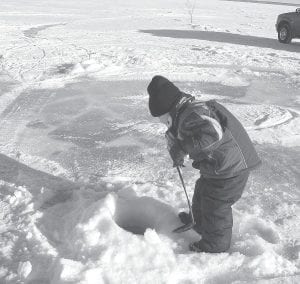 The Minnesota DNR encourages anglers to take a kid fishing on Saturday, Jan. 18 through Monday, Jan. 20. Take-A-Kid Fishing Weekend celebrates Minnesota’s winter heritage. Short times on the ice are best for young fishermen like this little boy.