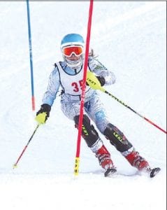 The performance of the Cook County Alpine team at the Moose Mountain Invite at Lutsen Mountains on Friday, January 10 was nothing short of phenomenal. Above left: Seventh-grade standout Reilly Wahlers races to a first place finish. Above: Freshman Will Lamb charges his way to the top of the poduim!