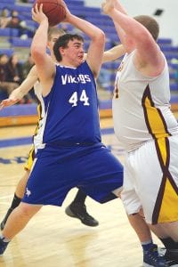 Closely guarded, Brandon Curtis fought for position against his defender and went around him to score 2 of his 9 points in the game against Barnum.