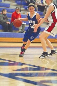 Fast dribbling Hannah Toftey used her ball handling skills to wheel around her defender and make a nice pass on this possession. Hannah and her twin sister Sarah are both freshman guards for the Vikings.