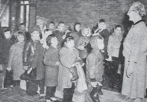 In this Feb. 20, 1964 News-Herald photo, Mrs. Ray Cummings lines up a group of children as they enter the new Birch Grove School at Tofte during opening day, Feb. 10. The newspaper described the first day as an exciting one for both students and teachers and noted that Principal Virginia Wegsten also had her picture taken, but the photographer had “bad luck” with it, so it can’t be shown. Attention was also called to the boots being carried by the children, who put them in the cloak rooms.