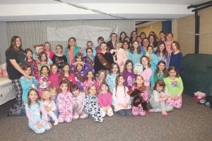 About 60 girls gathered at the Evangelical Free Church on Thursday, February 6 for an uproarious pajama party. Girl Scout Troop 4077 hosted the party which included a delicious spaghetti dinner and snacks, games like Twister and Limbo, face painting, arts and crafts and music. The price of admission was a new pair of pajamas to be donated to the Damiano Center in Duluth.