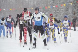 Did someone order snow? The skiers in the Sawtooth International cross country ski race on Saturday, February 15 had beautiful winter weather, if not perfect conditions for racing. Racers appeared to have a great time anyway. Here, Adam Swank of Duluth, who won both the classic and skate race, led the pack at the beginning of the classic race. Right behind him is Rhett Bonner of Duluth who finished second in both races. Also having a great race were local high school racers Sean MacDonell and Will Seaton on the right. .See more about the race at www.pincushion.org.