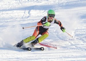 Two young Alpine skiers represented Cook County High School at the State Meet at Giants Ridge on Wednesday, February 12. Left: Freshman Will Lamb speeds down the slope at the State Meet to cap off a very successful season by finishing an impressive 14th out of a field of 89 skiers. Below: Reilly Wahlers, just a seventh-grader, is already racing against the best. She finished 49th in a field of 88 girls despite falling on her first run.