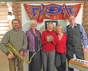 Celebrating the success of the Art ‘Round Town art show/fundraiser at the Johnson Heritage Post on Friday, February 14 were (L-R) jazz musician Eric Hahn, Art ‘Round Town organizer Ann Mershon, volunteers Thelma Hedstrom, Annie DeBevec and jazz musician Mike DeBevec. Thelma is holding the nice stack of cash raised at the event, which will be used toward a new student/artist collaborative work—a mosaic mural on the west wall of Johnson’s Grocery in Grand Marais. The event raised $3,200, which will go a long way toward the cost of the project, estimated to be $9,000. It also gave community members the opportunity to purchase some amazing artwork and just enjoy an evening of refreshments, wine and music at the Johnson Heritage Post. Anyone interested in contributing to the mural project can still do so. Just contact Ann Mershon at (218) 387-2245 or amershon@boreal.org to find out how.