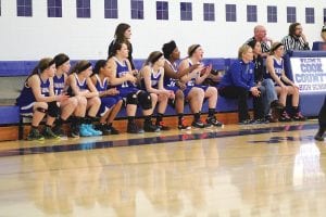 Players on the bench cheered on the players on the floor in a recent game. All of the kids on Coach Mitch Dorr’s basketball team have to keep up with what is going on in the game because everyone is expected to come in and play at the drop of the hat. This year, truly, there were no “bench” players.