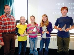 MathCounts! Coach Erik Hahn is joined by students (L-R) Robin Henrikson, Amelia Roth, Linnea Henrikson, and Andy Kern after the team’s fourth place finish in the regional competition. The team was joined by individual competitors Ellen Callender, Lucy Callender, Cedric Rock, and Nina Woerheide.