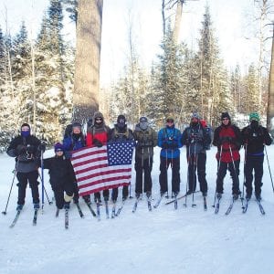 This team from the Combat Wounded Veteran Challenge braved arctic temperatures in January to find out how prosthetic limbs function in extreme cold. Despite the brutal temperatures, team members enjoyed their time in the peaceful Northwoods. Left: A student from St. Petersburg College checks the markers that record the movement of a veteran’s prosthetic lower limb.