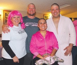 The participants in the Bald, Brave and Beautiful competition were great sports and allowed hair stylist Andrea Peterson (left) to shave their heads in front of the Mush for a Cure crowd at Windigo Lodge on Friday, March 7. (L-R) Peterson, Cory Christianson, Ana Genz, Craig Horak. All of them gave up their locks—and in Horak’s case, his beard—to raise money to fight breast cancer.