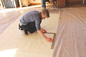 Upper left: Finn Garry takes a measurement. Lower left: Matthew Brown watches as Nina Woerheide operates the heavyduty sewing machine. Top: Noah Works and Ian Andrus put part of the yurt puzzle together. Above: The “roof” of the yurt is a work of art.