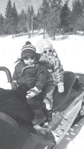 Two of the littlest snowmobile fanatics in Cook County—Bo and Sophia Christianson—enjoyed watching the snowmobile drag races on Poplar Lake last weekend.