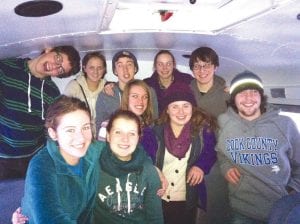 The Cook County High School Knowledge Bowl hosted two teams in recent competitions. Left: The group is pictured here on the way to an early competition. (L-R, front) Audrey Summers, Sophie Honeder. (L-R, middle) Melanie Stoddard, Danielle Hansen, Joey Chmelik. (L-R, back) Will Seaton, Haylie Anderson, Sean MacDonell, Libby Zafft, Bergen Soland. Above: Sean MacDonell, Joey Chmelik, and Will Seaton competed at the regional tournament on March 13 and won by 19 points. They are now preparing for the state Knowledge Bowl meet on April 10 - 11.